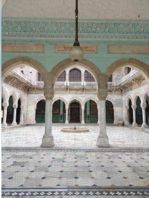 An arcaded courtyard with a central fountain