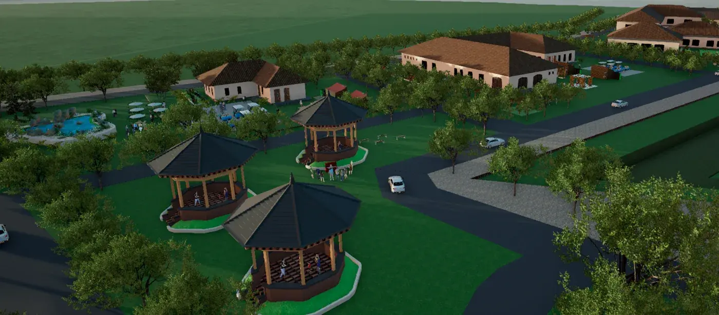 Aerial render of the wellness centre campus — low tiled-roof pavilions, timber gazebos and planted courtyards